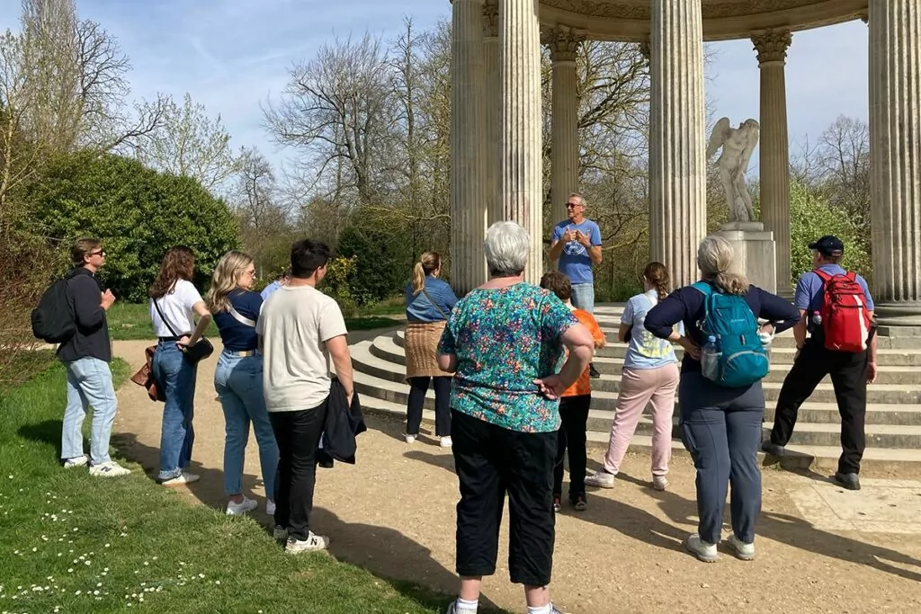 Tour guide confidently addressing a group, showcasing strong leadership and communication skills