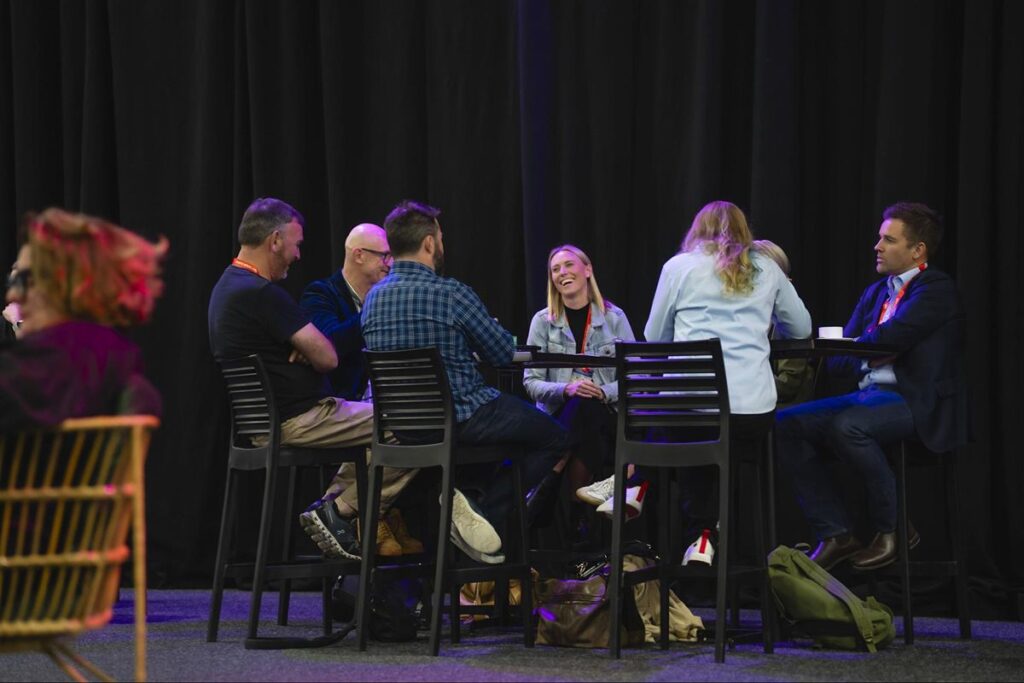 Attendees seated in a roundtable discussion format.